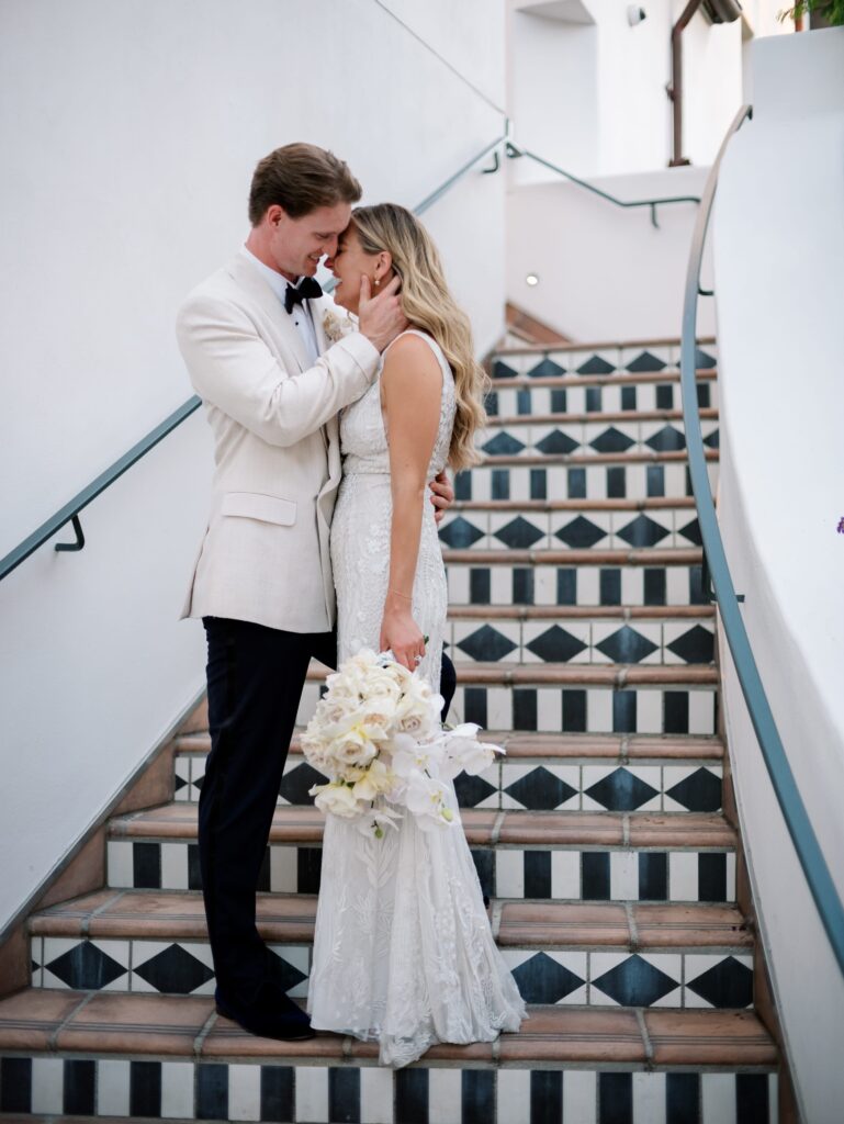 Dan and Akasha, Bride and Groom, on the stairs of Hotel Californian